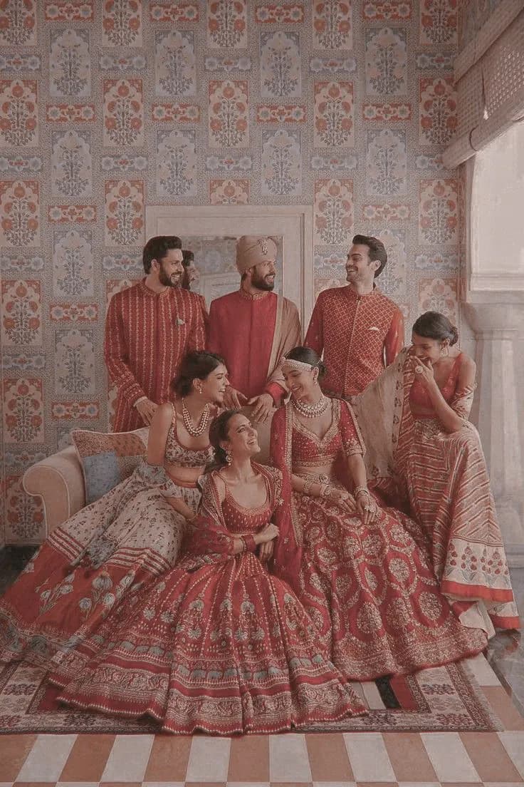 Wedding Party Dressed In Red In A Frescoed Room